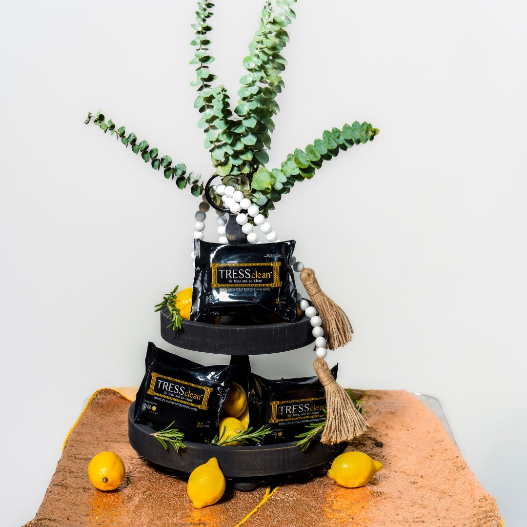 Tress Cleans braid, loc & Scalp refreshening wipes display with all natural products. Lemon and eucalyptus used to cleanse hair.